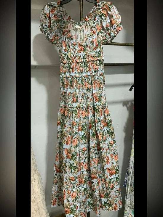 doen leanne dress Discover the Stunning from Den's Latest Collection poplin and has puffed sleeves and a flexible shirred waistband Doen Blue Leanne Floral-Print Cotton